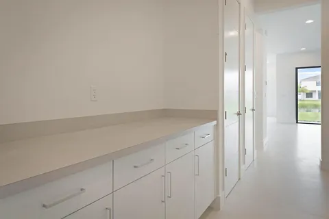 an empty room with wooden floor