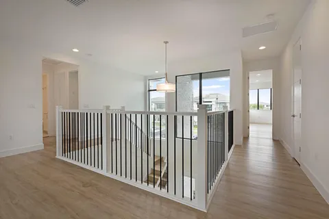 a view of a hallway with windows