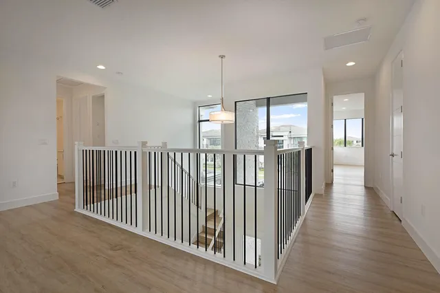 a view of a hallway with windows