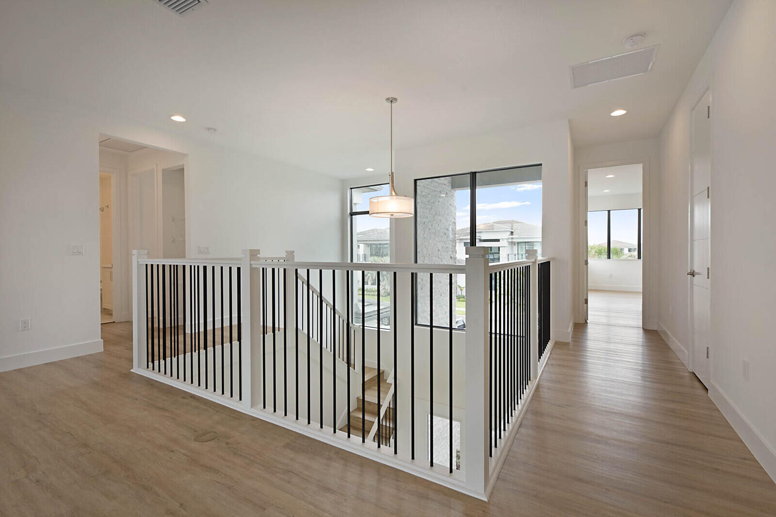 17062 Watersprite Lakes Road Boca Raton, FL 33496 - Photo 20 of 42 a view of a hallway with windows