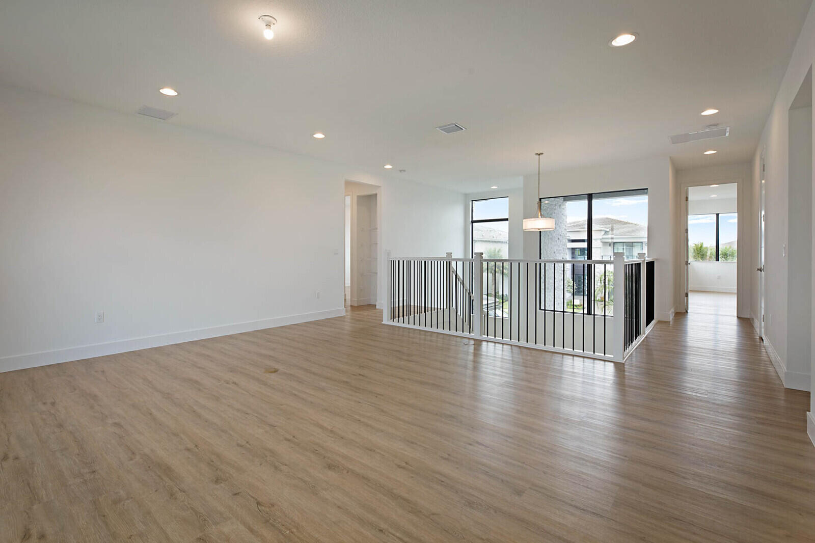 17062 Watersprite Lakes Road Boca Raton, FL 33496 - Photo 21 of 42 a view of a hallway with wooden floor