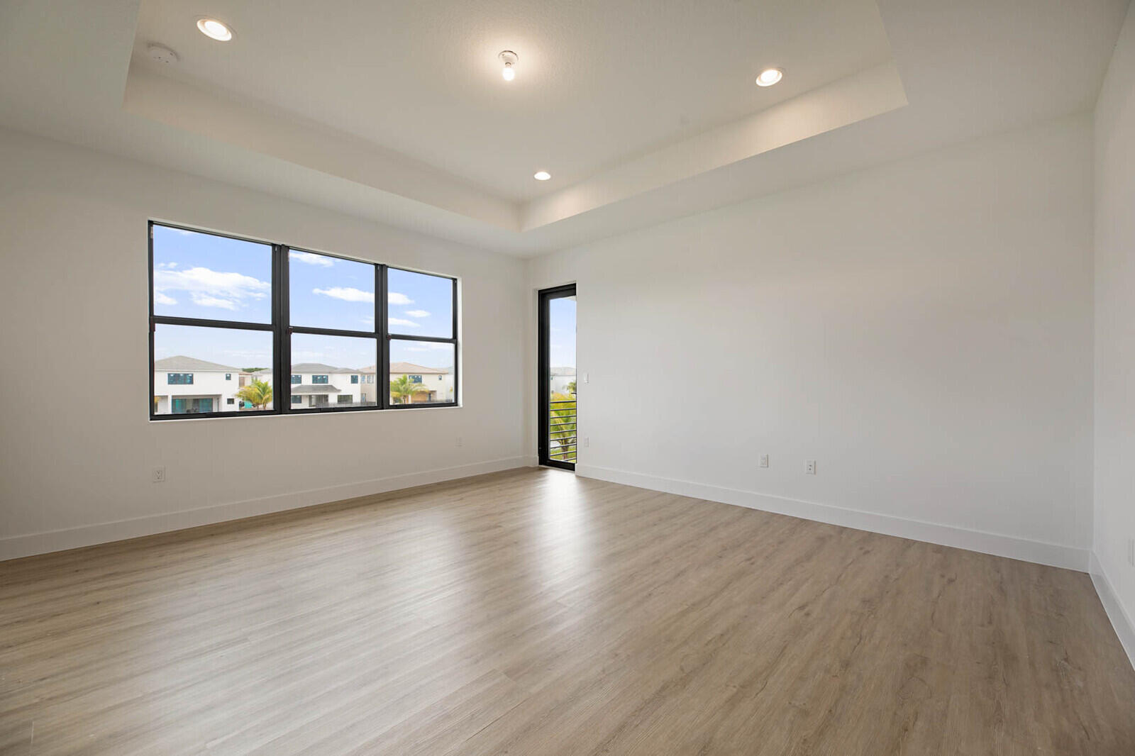 17062 Watersprite Lakes Road Boca Raton, FL 33496 - Photo 24 of 42 wooden floor in an empty room with a window