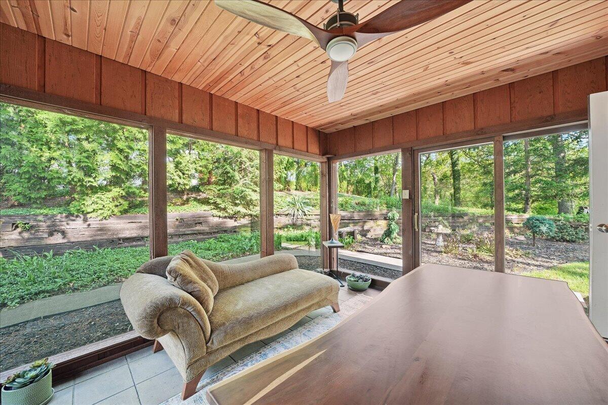 63 Ski Hill Road Portage, IN 46368 - Photo 7 of 28 a bedroom with furniture and large windows