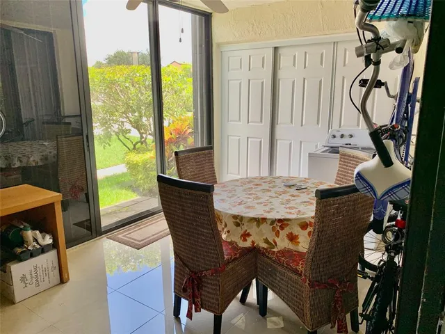 a view of a dining room with furniture window and outside view