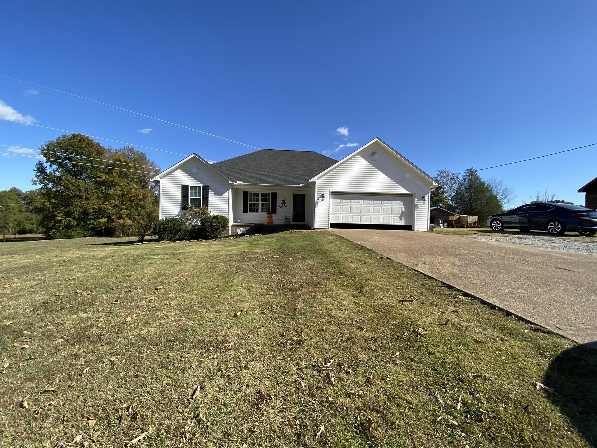 845 Simmons Road Henderson, TN 38340 - Photo 1 of 21 a front view of a house with a yard