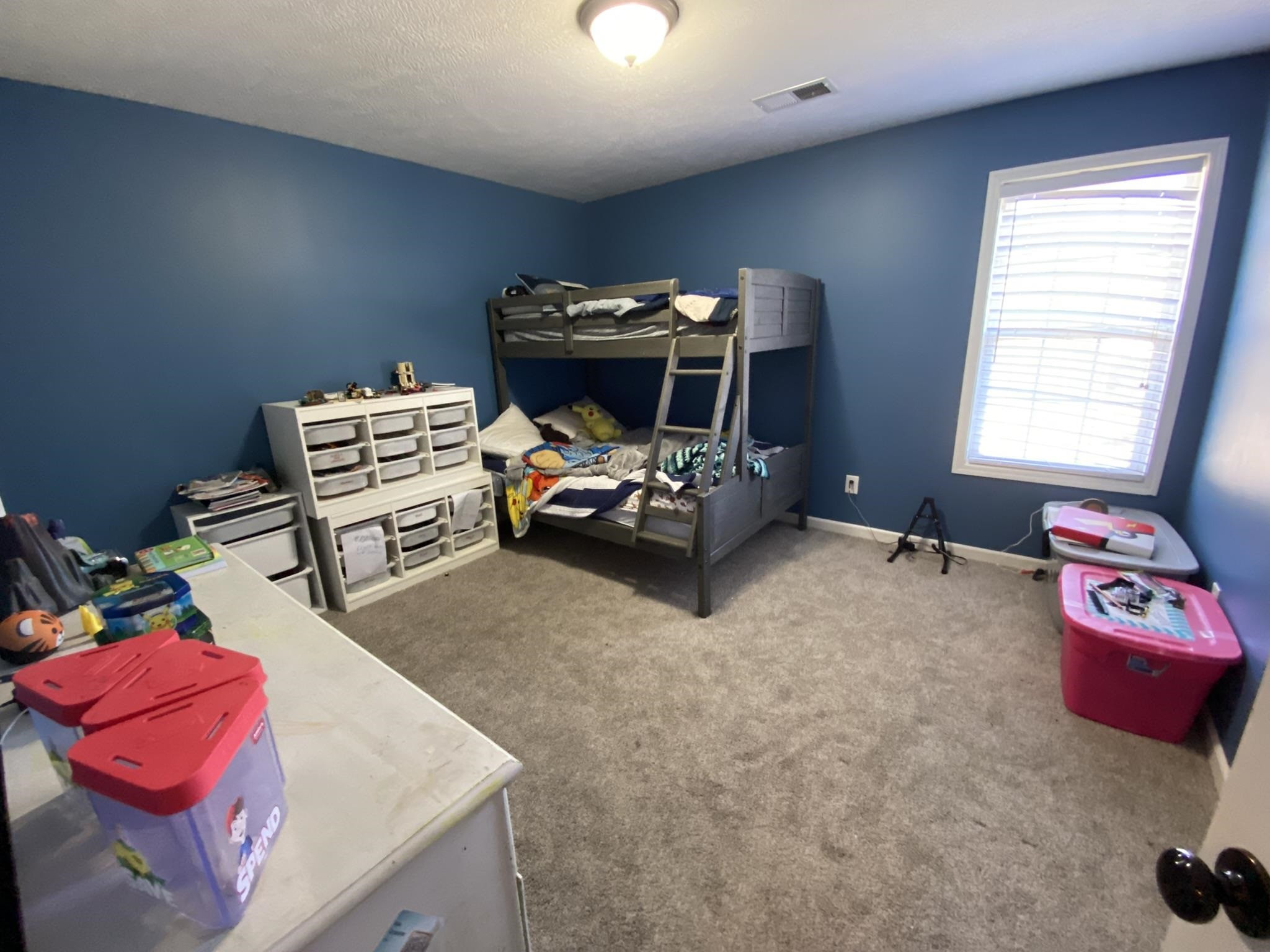 845 Simmons Road Henderson, TN 38340 - Photo 13 of 21 a living room with furniture and a flat screen tv