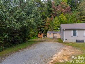 179 Fresh Water Rdg Road Whittier, NC 28789 - Photo 32 of 48 a house with trees in front of it
