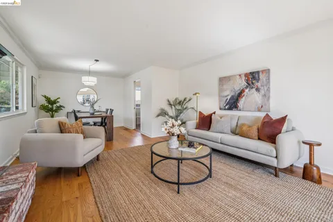 a kitchen with a sink and a stove next to a window