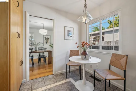 a large bed sitting in a bedroom next to a window