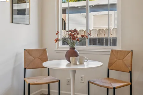 a bedroom with a bed and a potted plant