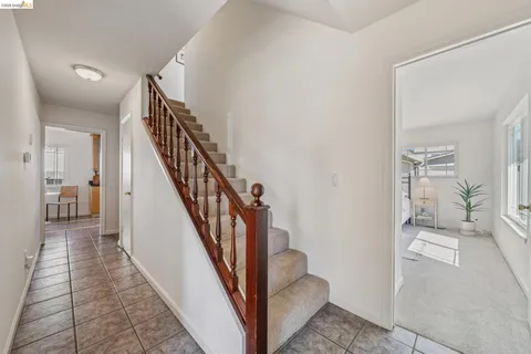 a dining room with furniture a rug and a chandelier