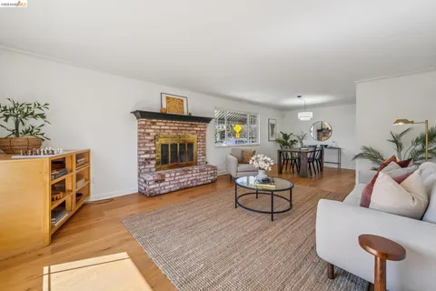 a view of a room that has a table and chairs in it