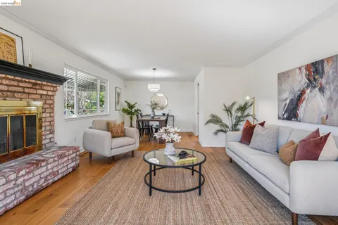 a large kitchen with stainless steel appliances granite countertop a stove a sink and a refrigerator