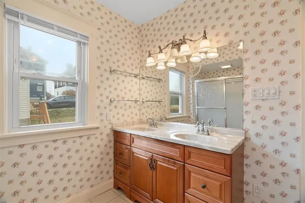 a bathroom with a sink a vanity and a mirror