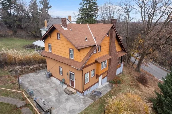 a aerial view of a house with a yard