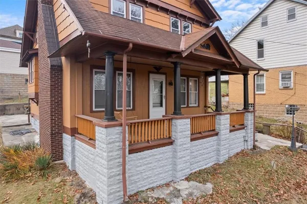 a front view of a house with a porch