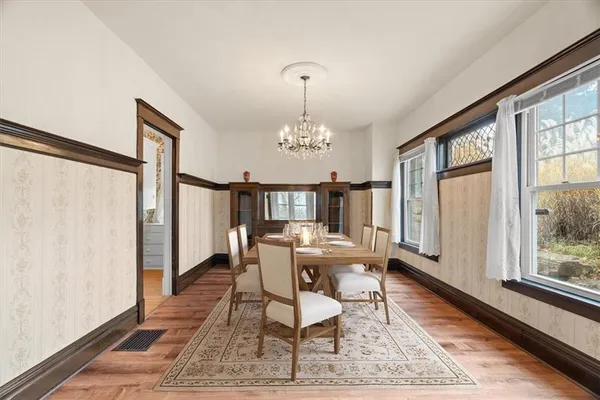 a view of a dining room with furniture window and wooden floor