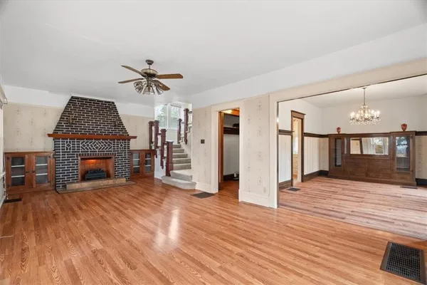 a view of a livingroom with furniture and a fireplace
