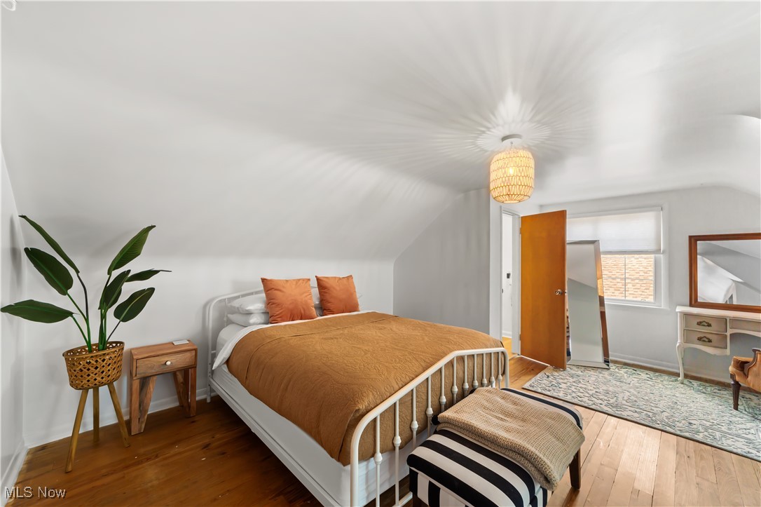4648 Ammon Road Cleveland, OH 44143 - Photo 25 of 48 Bedroom featuring vaulted ceiling and dark hardwood flooring