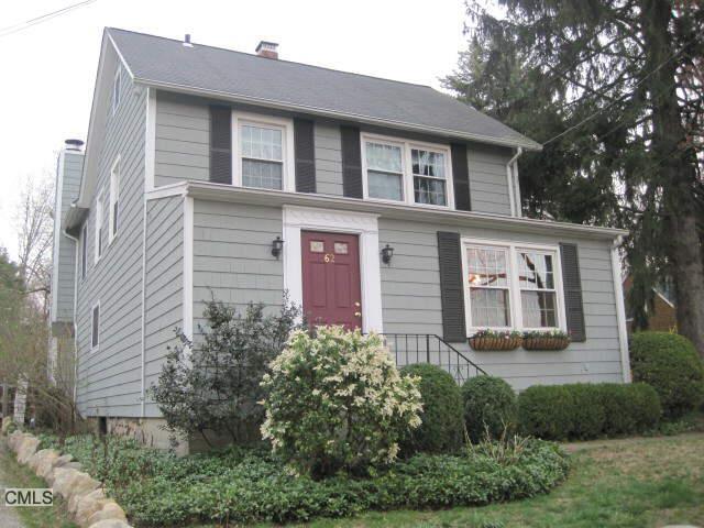 62 Olmstead Lane Ridgefield, CT 06877 - Photo 1 of 1 a front view of a house with garden