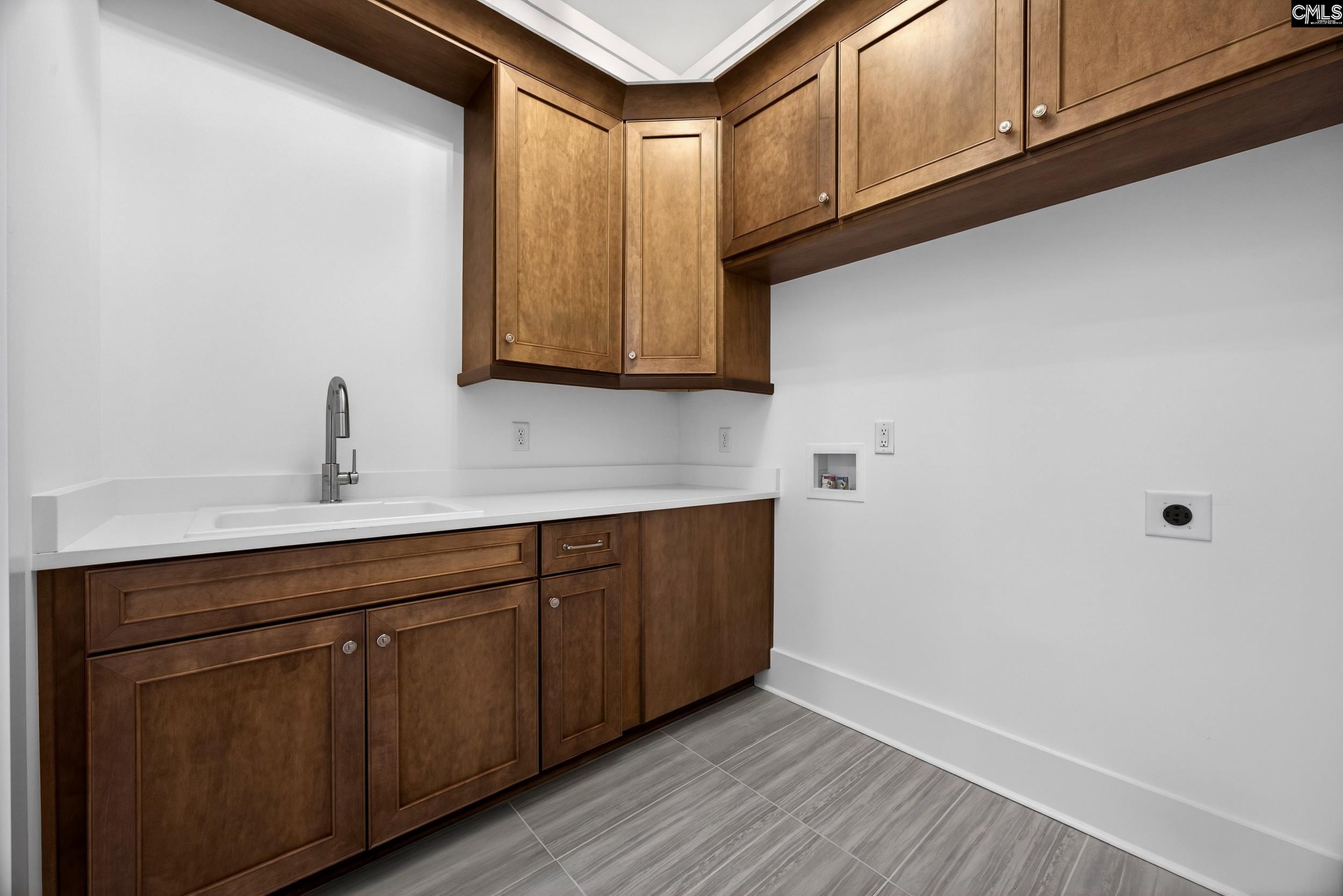 1318 Long Grove Way Lexington, SC 29072 - Photo 56 of 90 a kitchen with cabinets a sink and dishwasher