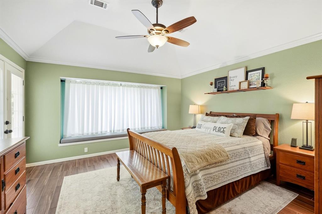 524 Post Oak Road Grapevine, TX 76051 - Photo 22 of 37 Tray ceiling with a ceiling fan, wood-finish flooring, built-in window seating, and a wall-mounted shelf