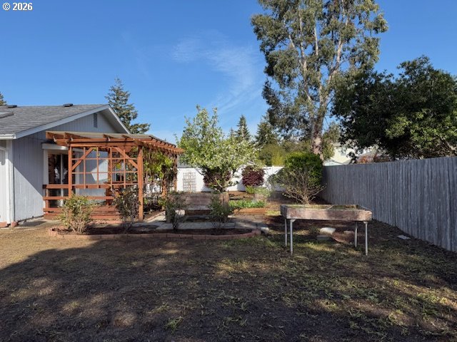 2164 24th Street Florence, OR 97439 - Photo 11 of 42 a view of a house with a yard