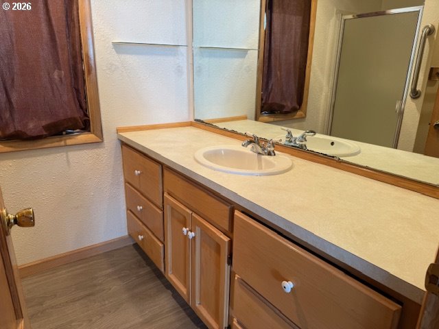 2164 24th Street Florence, OR 97439 - Photo 34 of 42 a bathroom with a sink and a mirror