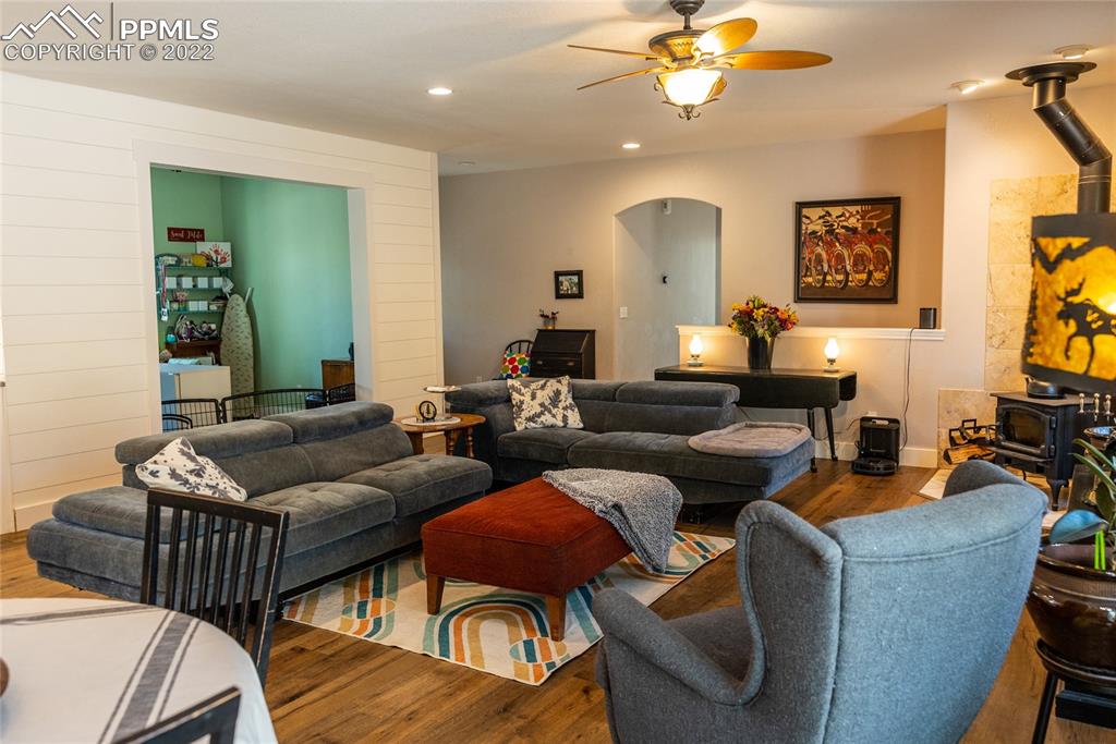 10220 Hardy Road Colorado Springs, CO 80908 - Photo 12 of 36 a living room with furniture and a chandelier