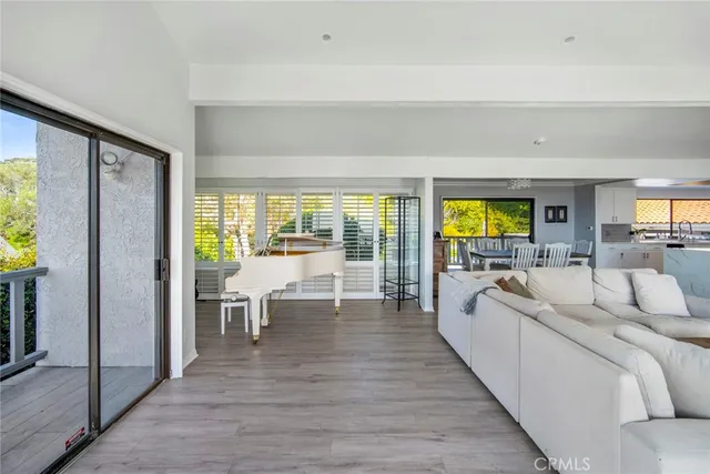a view of a dining room with furniture and a window