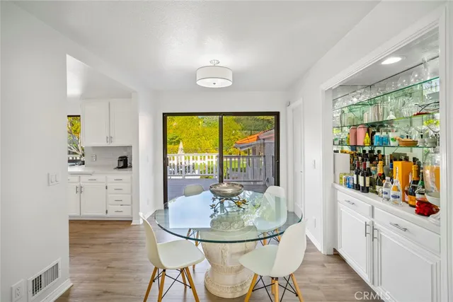 a spacious bedroom with a bed a couch and a window