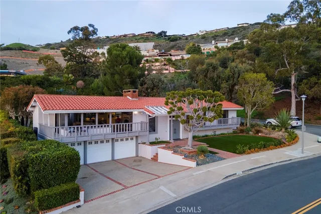 an aerial view of a house with a garden