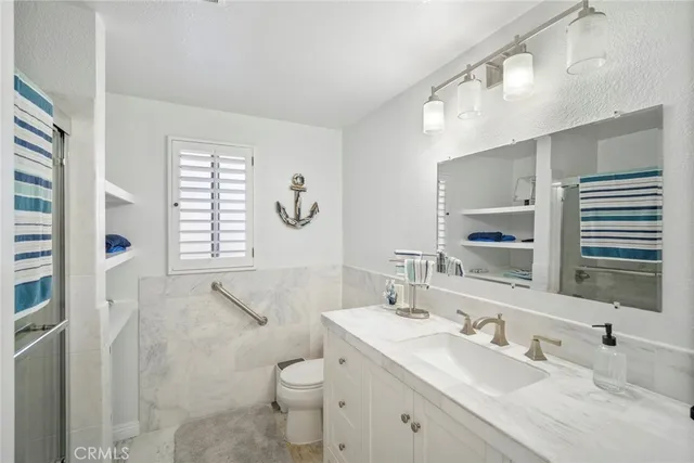 a view of a patio with a table and chairs and potted plants