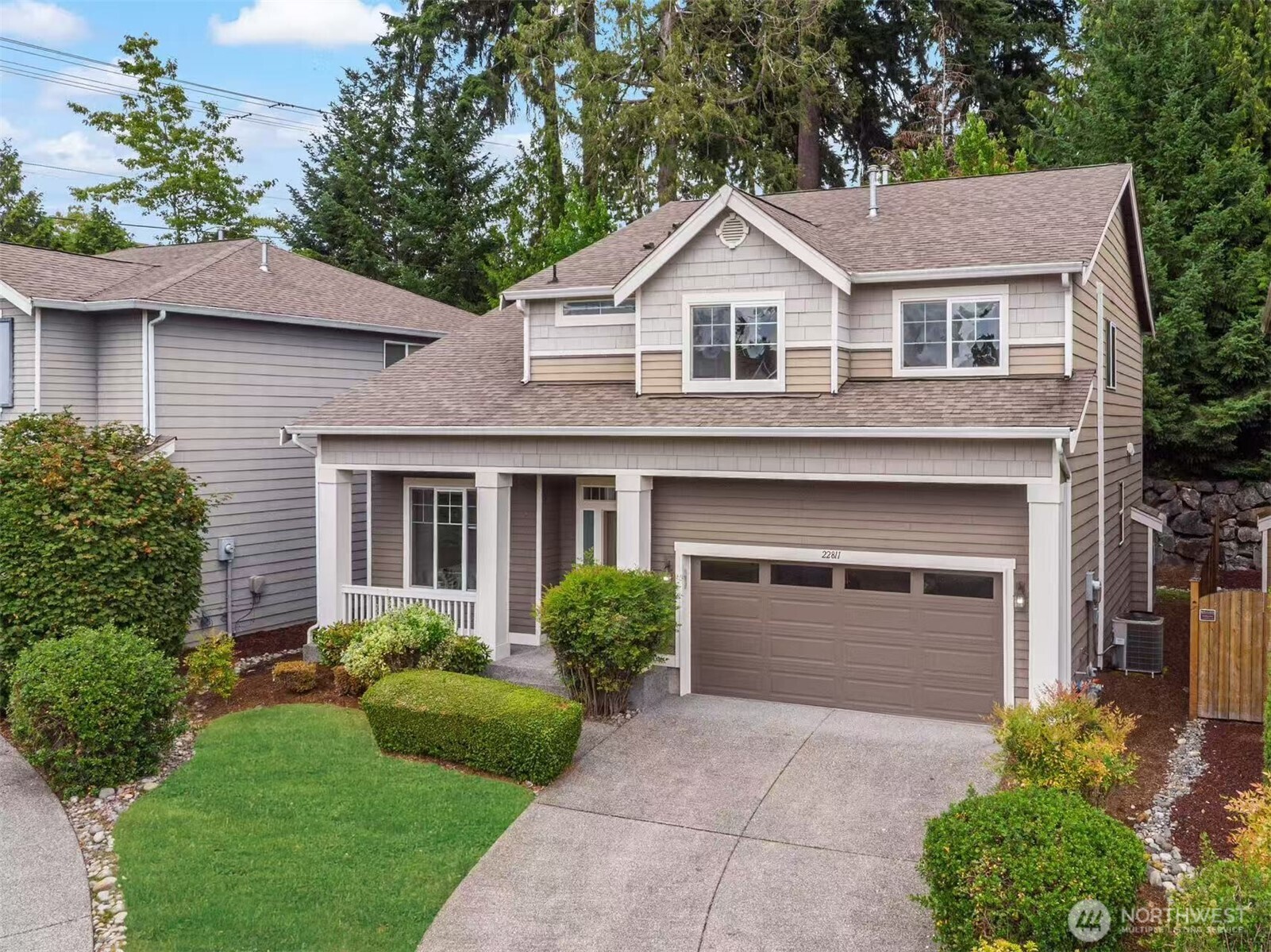 22811 36th Drive Southeast Bothell, WA 98021 - Photo 1 of 34 a front view of a house with a yard and garage