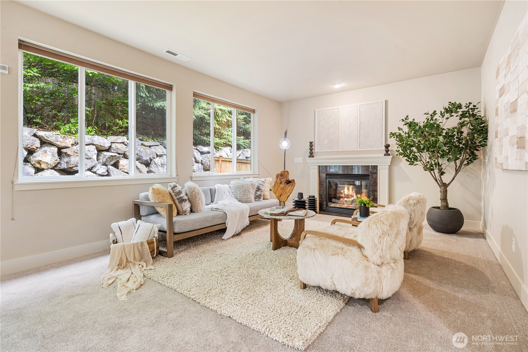 22811 36th Drive Southeast Bothell, WA 98021 - Photo 13 of 34 a living room with furniture a fireplace and a potted plant