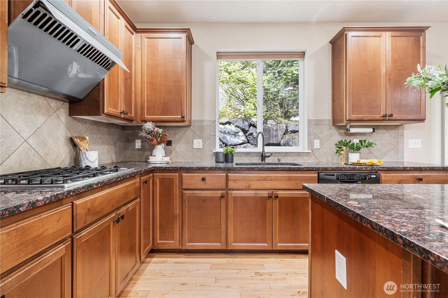 22811 36th Drive Southeast Bothell, WA 98021 - Photo 8 of 34 a kitchen with stainless steel appliances granite countertop a sink stove and cabinets