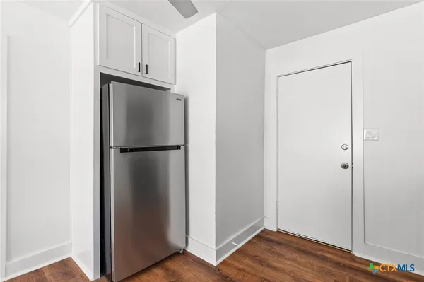 a view of a room with wooden floor and closet