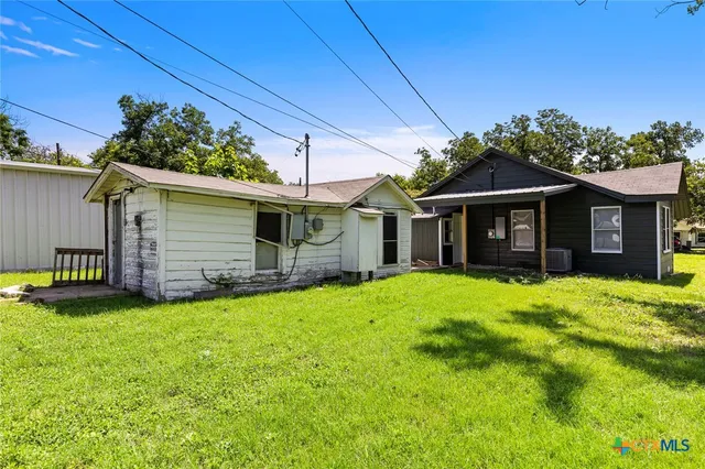 a backyard of a house with seating space