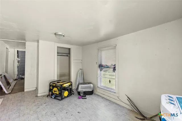 a kitchen with a stove a sink and a refrigerator