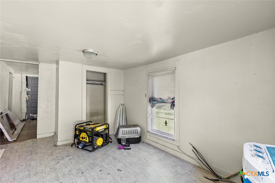 1020 South 23rd Street Temple, TX 76504 - Photo 34 of 38 a bedroom with furniture and a mirror