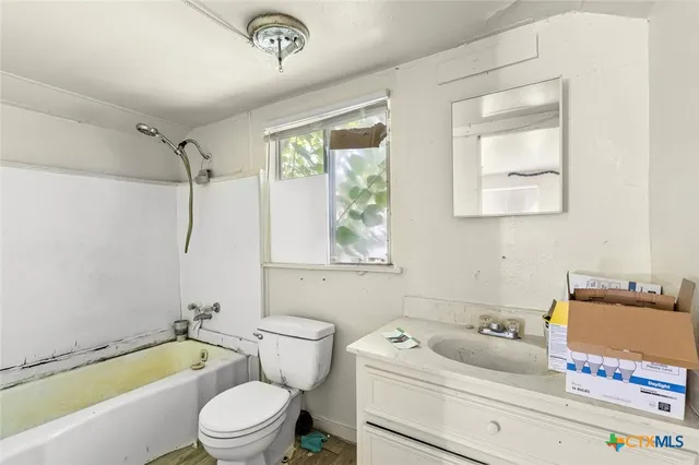 a view of a room with a window and closet