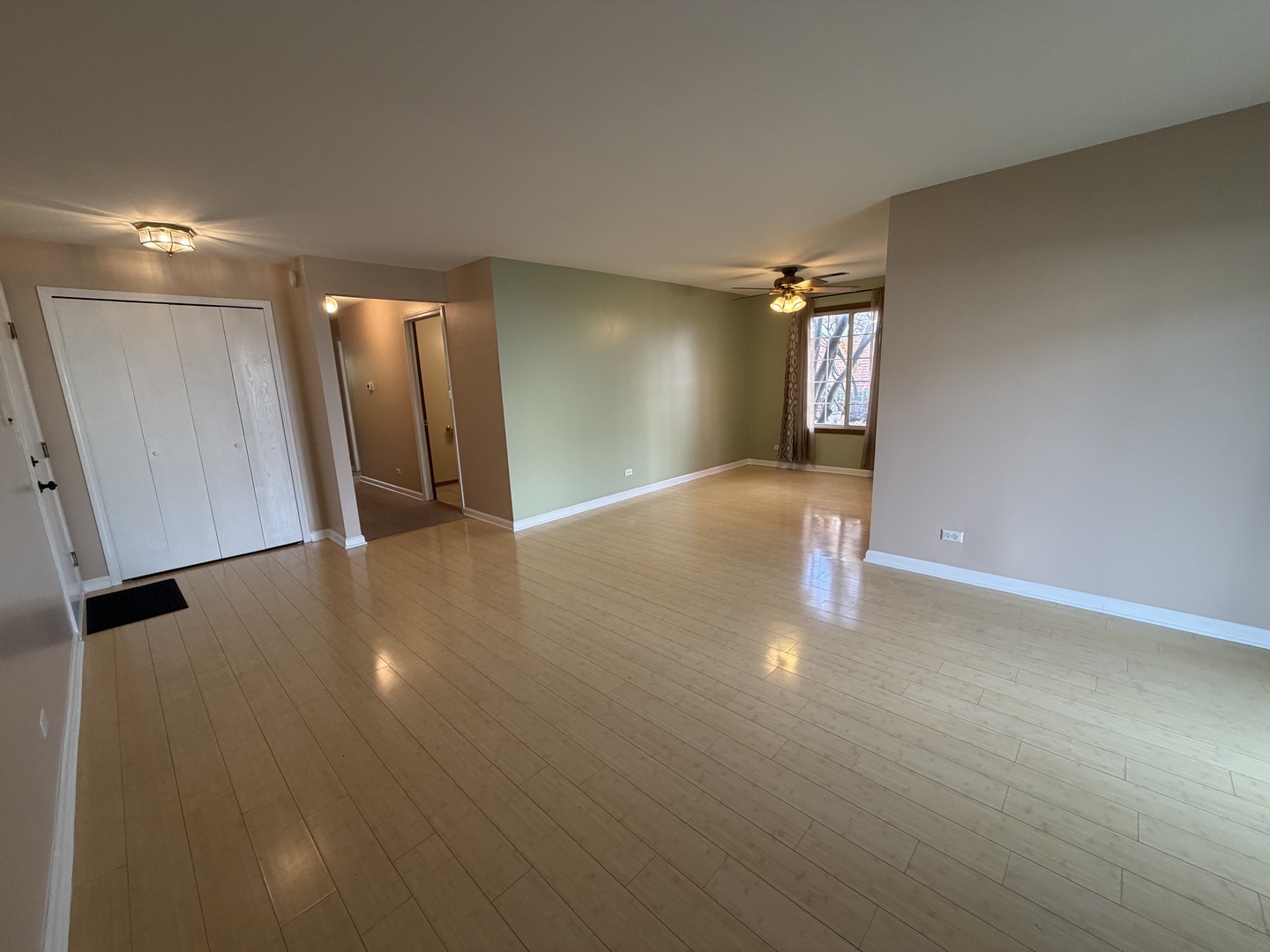 311 Sheffield Court, Unit 1 Roselle, IL 60172 - Photo 4 of 29 a view of an empty room with wooden floor