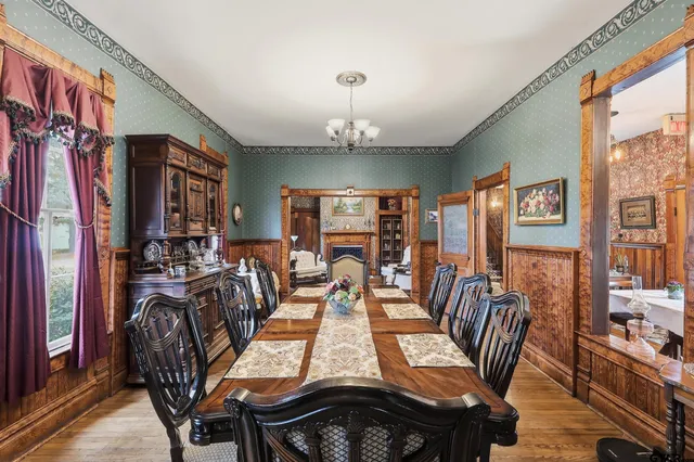 a kitchen with stainless steel appliances granite countertop a refrigerator a stove and a sink