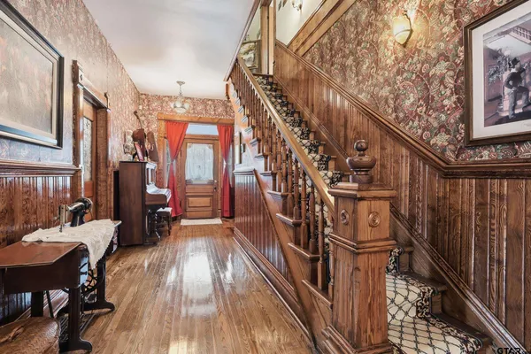 a view of living room with furniture and a mirror
