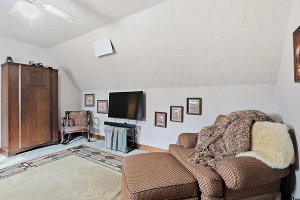 a view of a house with a yard covered with snow in the road
