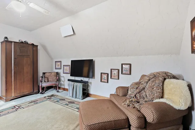 a view of a house with a yard covered with snow in the road