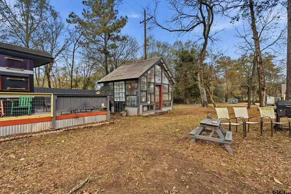 a view of a wooden deck with a yard