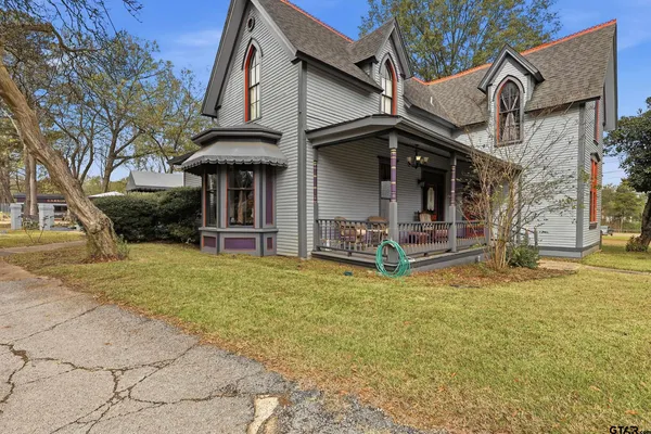 a view of a large garden with large trees