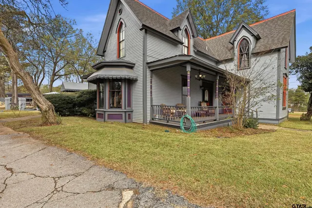 a view of a large garden with large trees