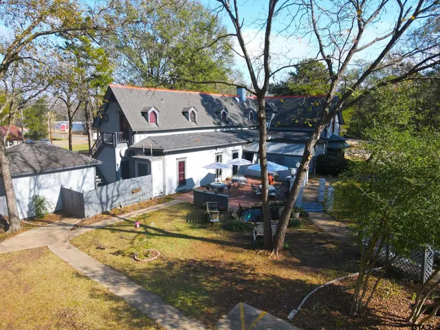 a view of a patio with a yard